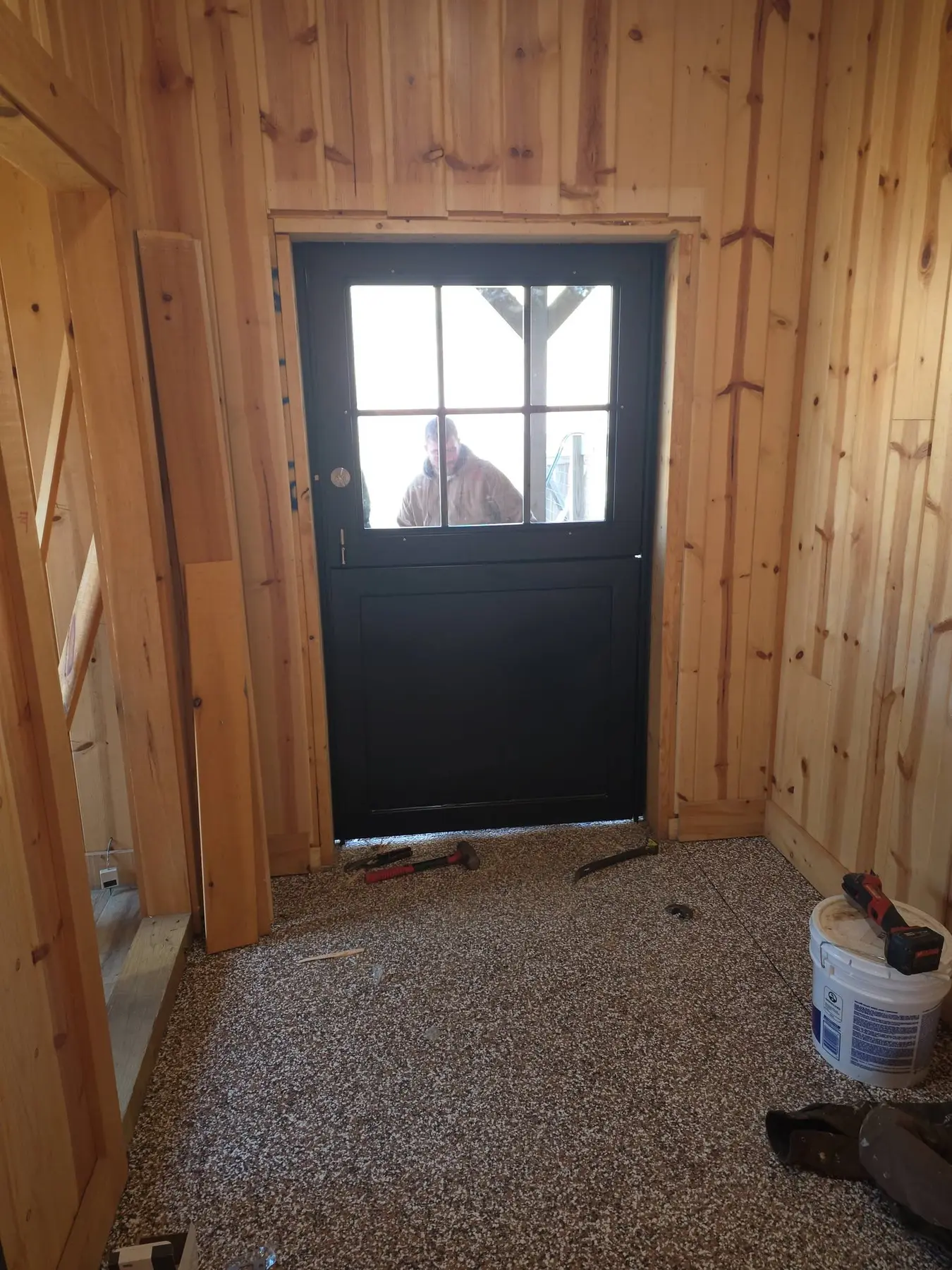 New stable door viewed from inside with natural light through the upper window