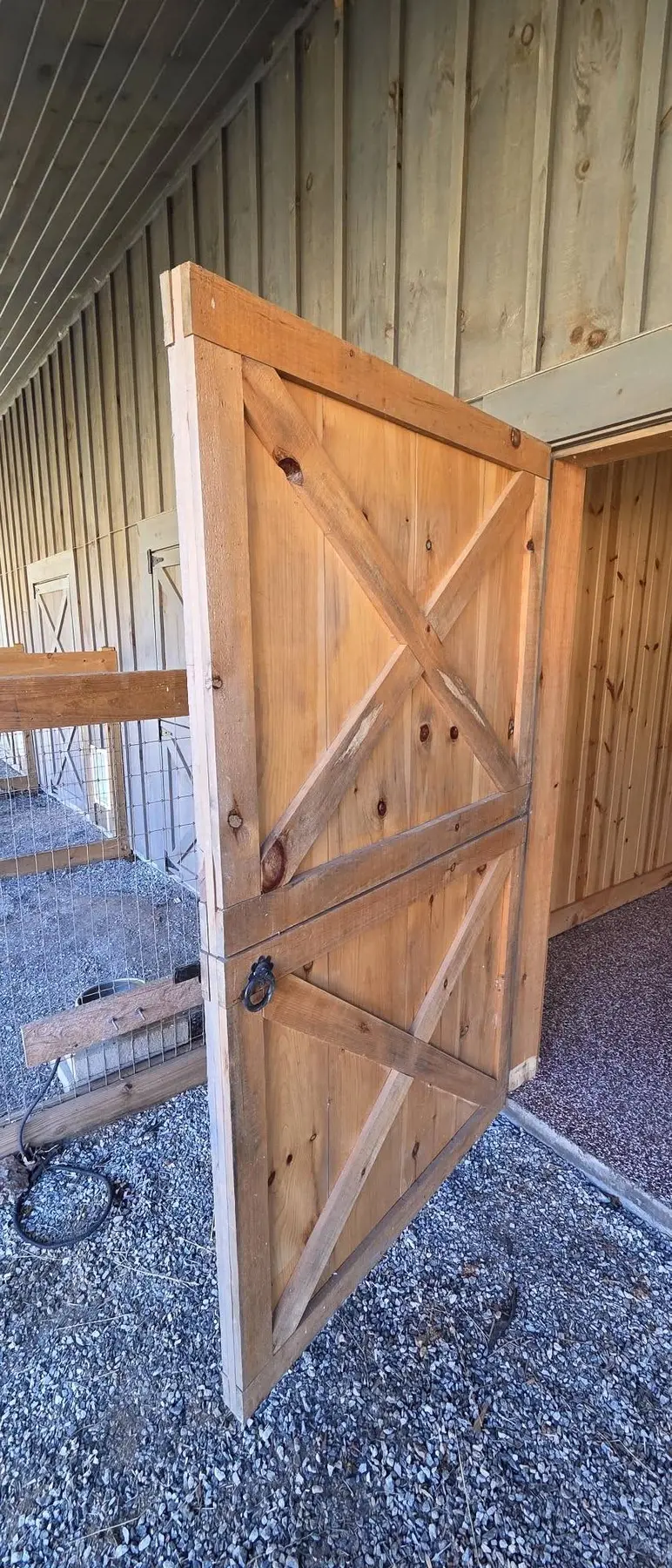 Worn wooden horse stable door before replacement