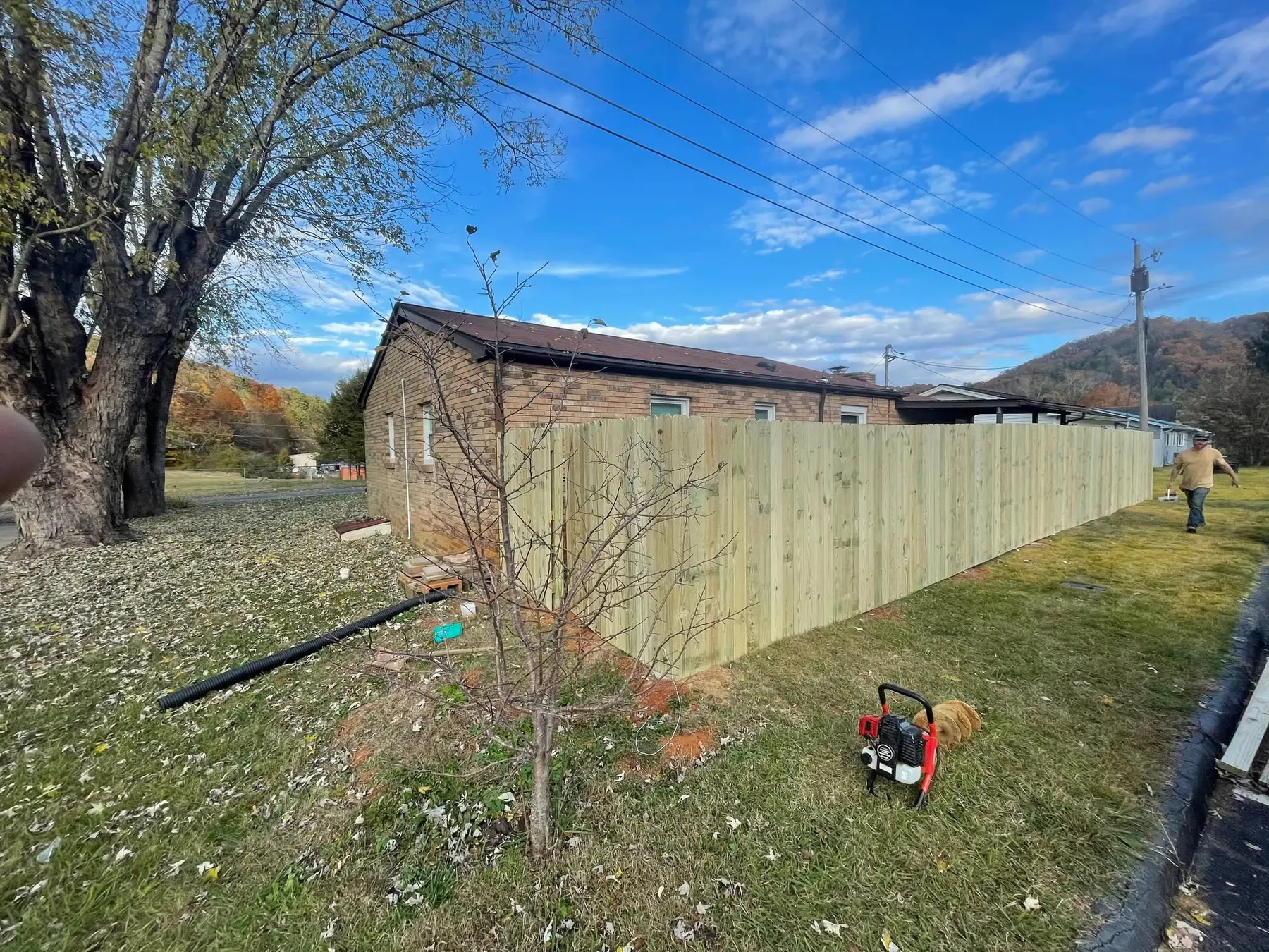 Long finished privacy fence following the edge of the home